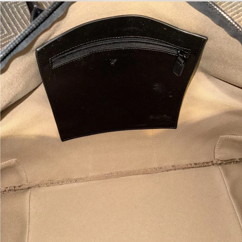 Uri Minkoff tan and black leather geometric design travel bag